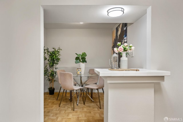 dining area featuring baseboards