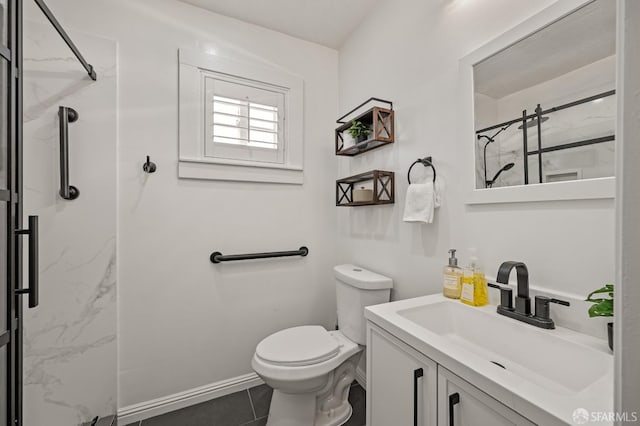 full bath featuring vanity, toilet, a marble finish shower, baseboards, and tile patterned flooring