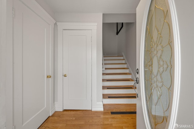 stairway with wood finished floors