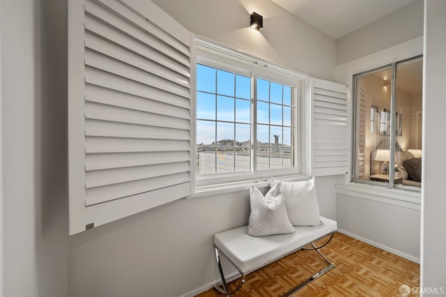unfurnished room with baseboards