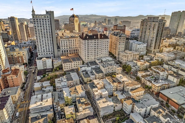 property's view of city featuring a mountain view