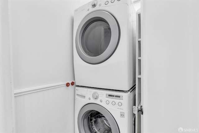 washroom with stacked washer and dryer