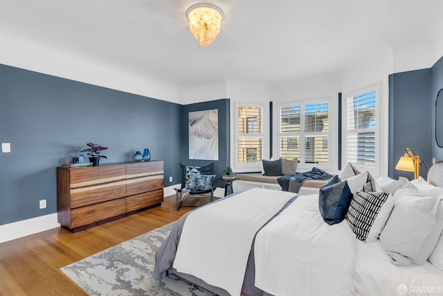 bedroom with wood-type flooring