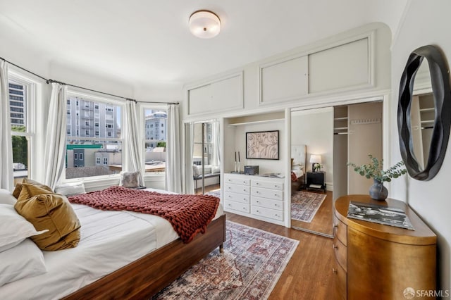 bedroom with light wood-style flooring