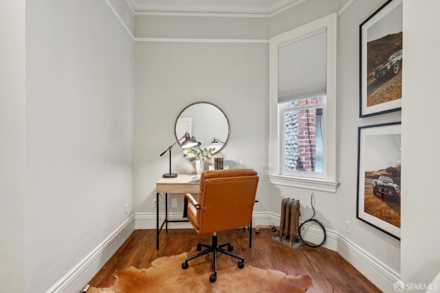 office area featuring crown molding, baseboards, and wood finished floors