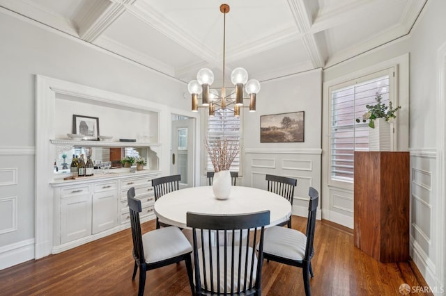 dining room featuring beam ceiling, a decorative wall, a chandelier, dark wood finished floors, and coffered ceiling