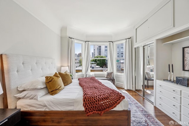 bedroom with wood finished floors