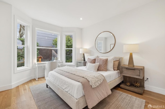 bedroom with light hardwood / wood-style flooring