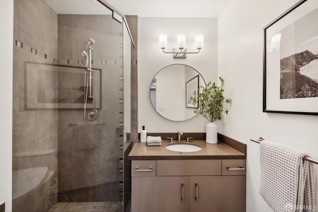 bathroom featuring vanity and a tile shower