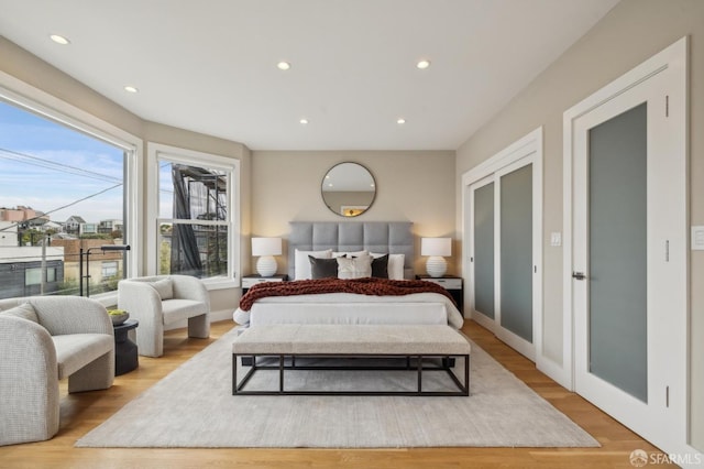 bedroom with light hardwood / wood-style floors