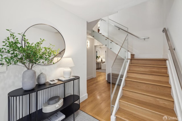 stairway featuring hardwood / wood-style floors