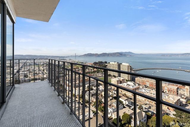 balcony with a water and mountain view