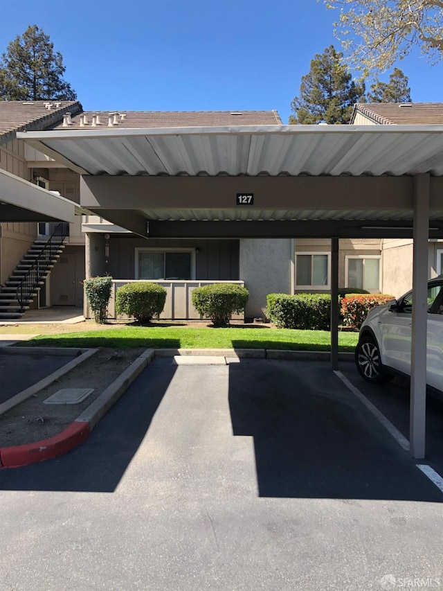 view of parking featuring a carport