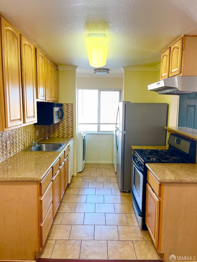 kitchen featuring tasteful backsplash, gas stove, crown molding, sink, and light tile patterned floors