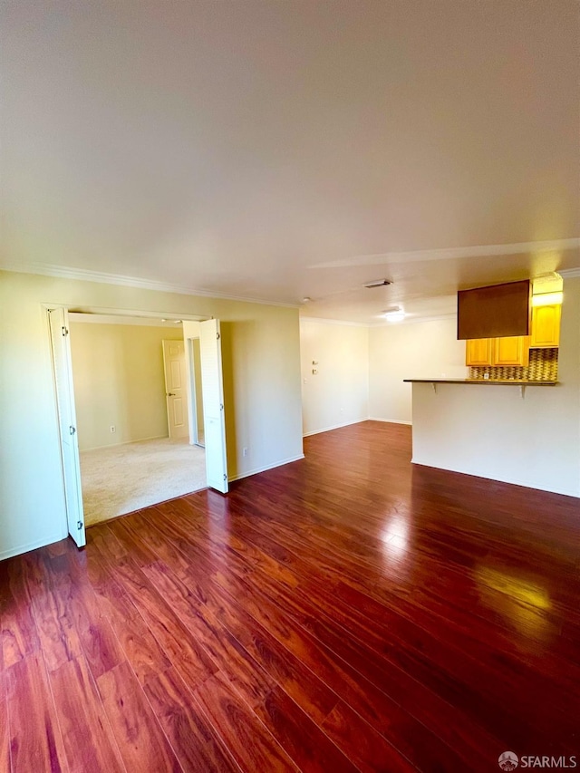 unfurnished living room featuring dark hardwood / wood-style floors