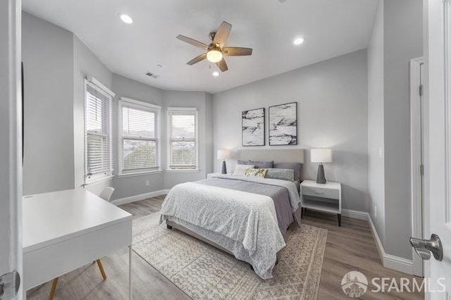 3004 26th St, San Francisco, CA 94110 - bedroom featuring baseboards, wood finished floors, recessed lighting, and a ceiling fan