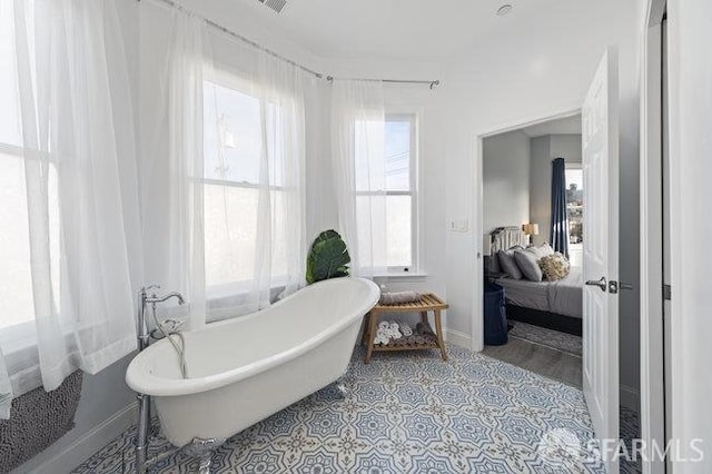 3004 26th St, San Francisco, CA 94110 - full bathroom with baseboards, a soaking tub, and ensuite bath