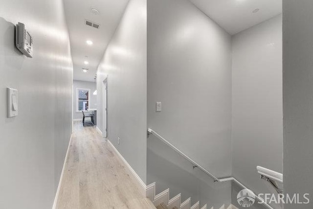 3004 26th St, San Francisco, CA 94110 - hallway with wood finished floors, an upstairs landing, baseboards, and recessed lighting