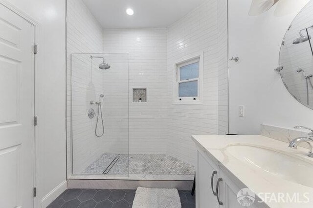 3004 26th St, San Francisco, CA 94110 - bathroom with tile patterned floors, a tile shower, and vanity