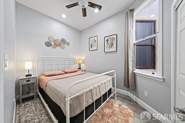 3004 26th St, San Francisco, CA 94110 - bedroom with wood finished floors, baseboards, and a ceiling fan