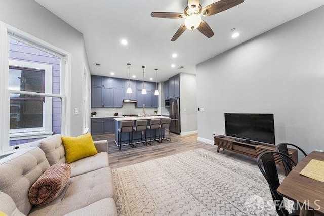 3004 26th St, San Francisco, CA 94110 - living area featuring light wood-style flooring, a ceiling fan, recessed lighting, and baseboards