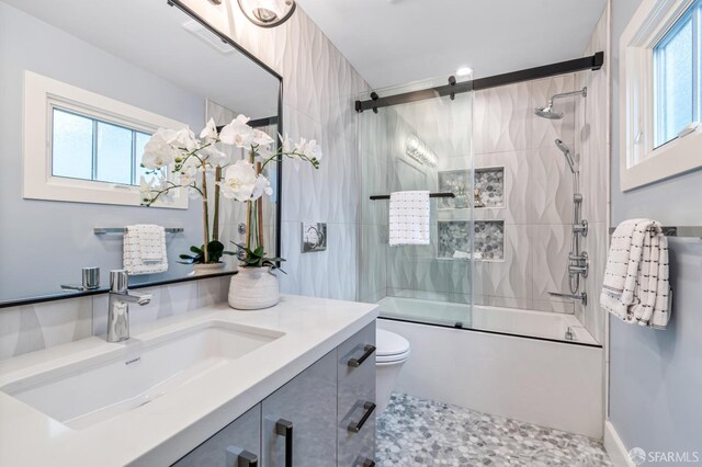 65 San Pablo Ave, San Francisco, CA 94127 - full bath featuring toilet, bath / shower combo with glass door, vanity, and a wealth of natural light