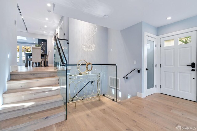 65 San Pablo Ave, San Francisco, CA 94127 - entryway featuring visible vents, baseboards, an inviting chandelier, recessed lighting, and wood finished floors