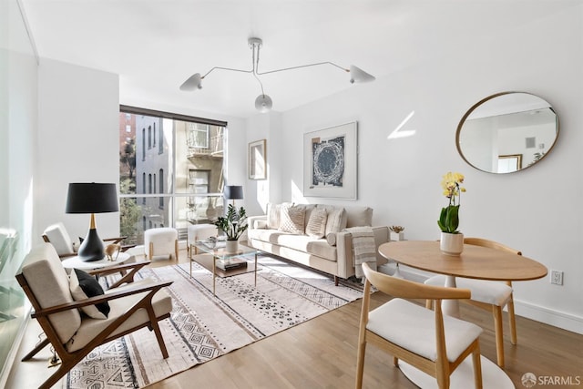 living area featuring wood finished floors and baseboards