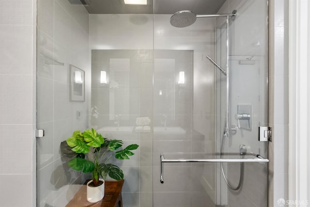 full bath with a shower stall