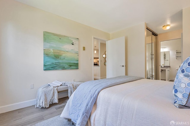 2225 23rd St Unit 318, San Francisco, CA 94107 - bedroom with wood finished floors and connected bathroom