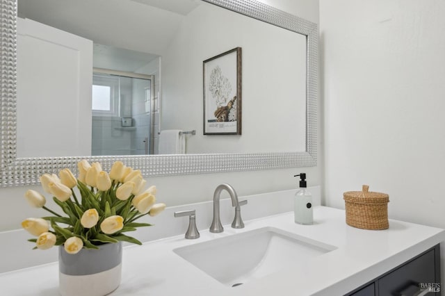 bathroom featuring a shower stall and vanity