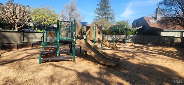 communal playground featuring fence