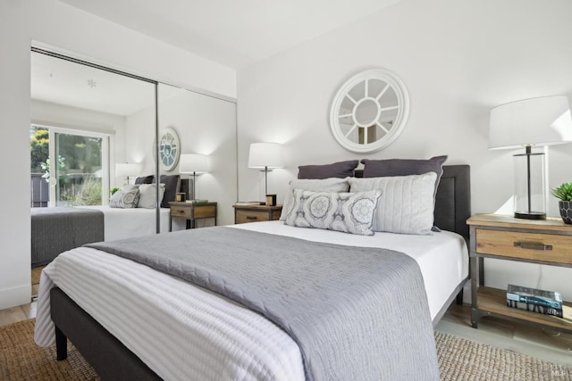 bedroom featuring a closet and wood finished floors