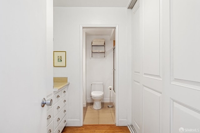 full bathroom featuring vanity, tile patterned flooring,  shower combination, and toilet