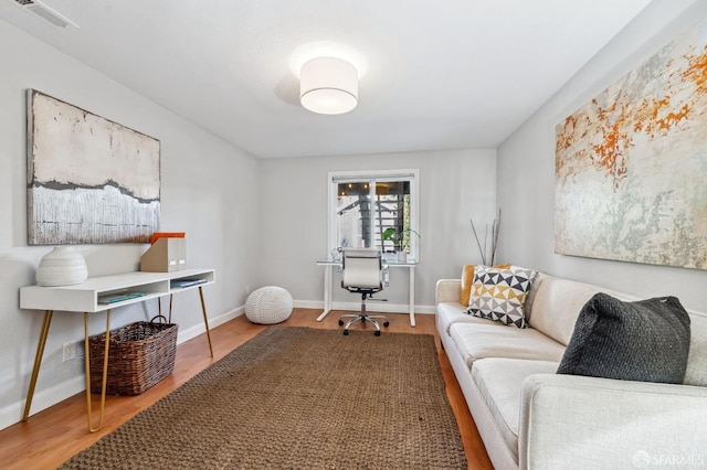 home office featuring hardwood / wood-style floors