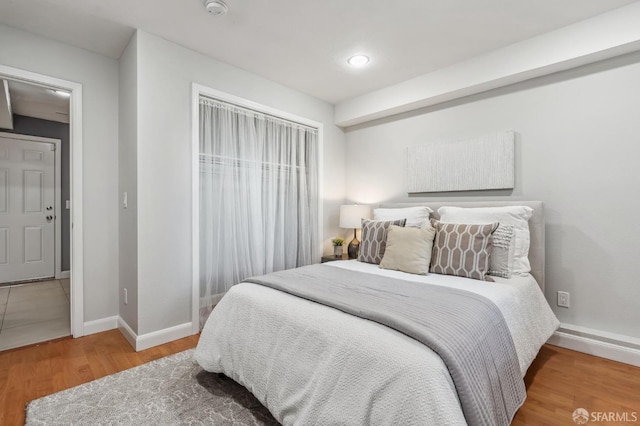 bedroom with hardwood / wood-style flooring