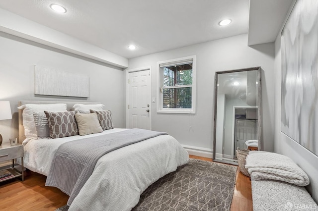 bedroom with wood-type flooring