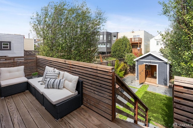 wooden terrace featuring outdoor lounge area and a shed