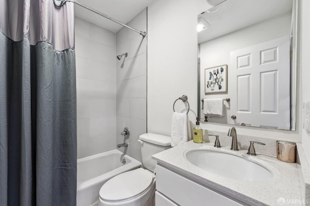 full bathroom featuring vanity, shower / tub combo, and toilet