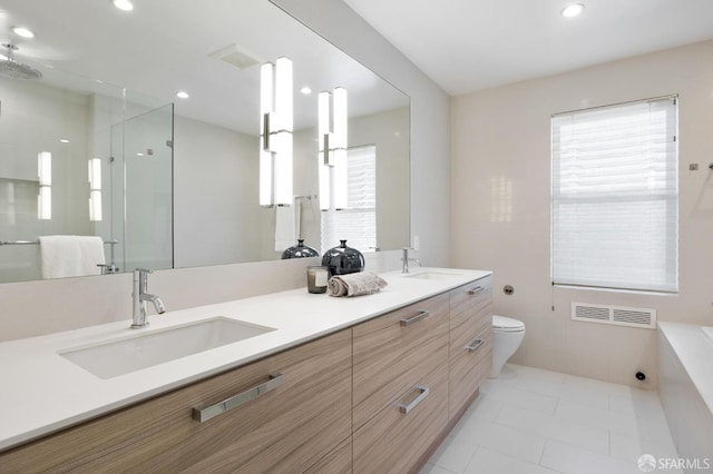 bathroom featuring tile patterned floors, an enclosed shower, vanity, and toilet