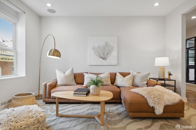 living room with light hardwood / wood-style flooring