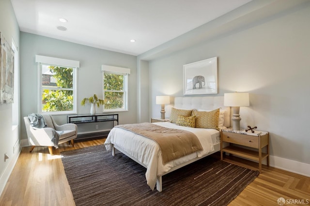 bedroom with wood-type flooring