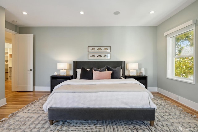 bedroom with wood-type flooring