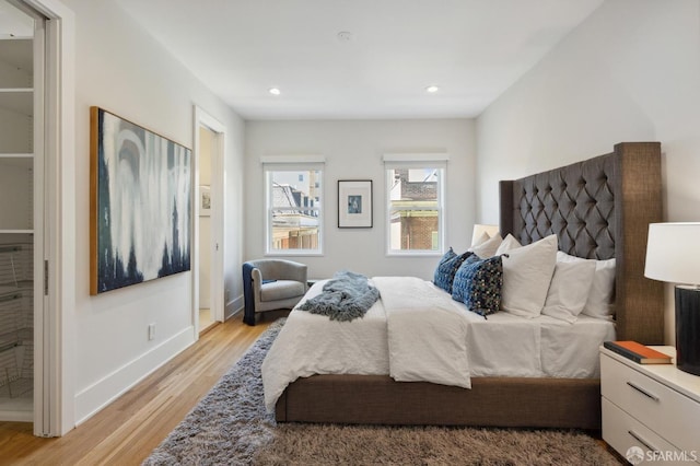 bedroom with light hardwood / wood-style flooring