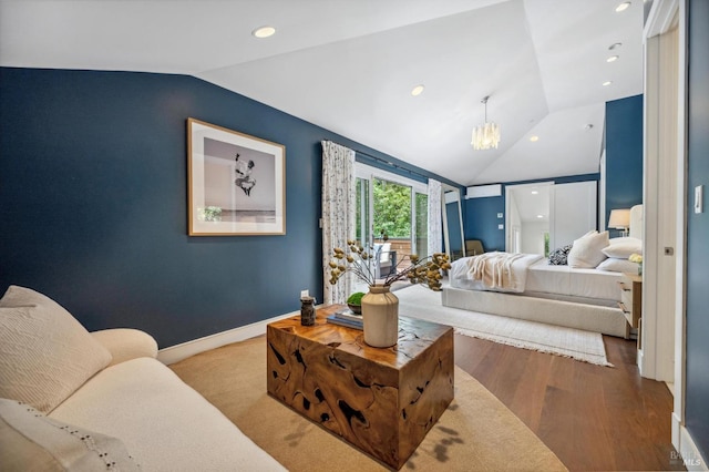 bedroom featuring recessed lighting, a chandelier, wood finished floors, and vaulted ceiling