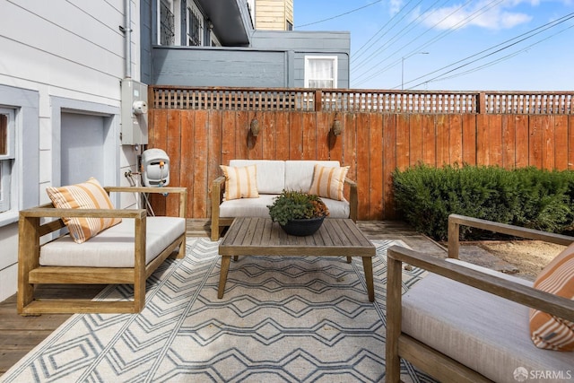 view of patio / terrace with fence and an outdoor living space