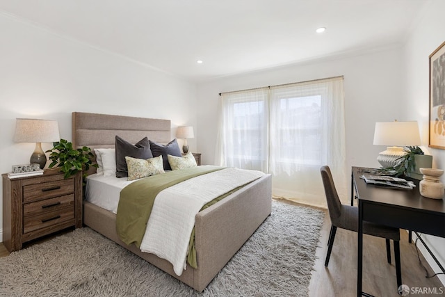 bedroom featuring recessed lighting and light wood-style floors