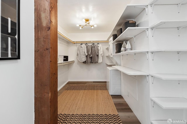 spacious closet with wood finished floors