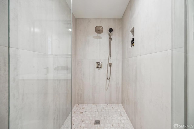 full bathroom with tiled shower