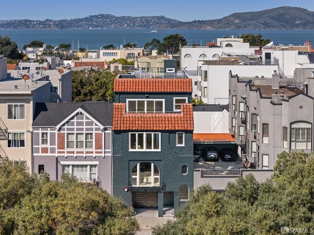 birds eye view of property featuring a mountain view